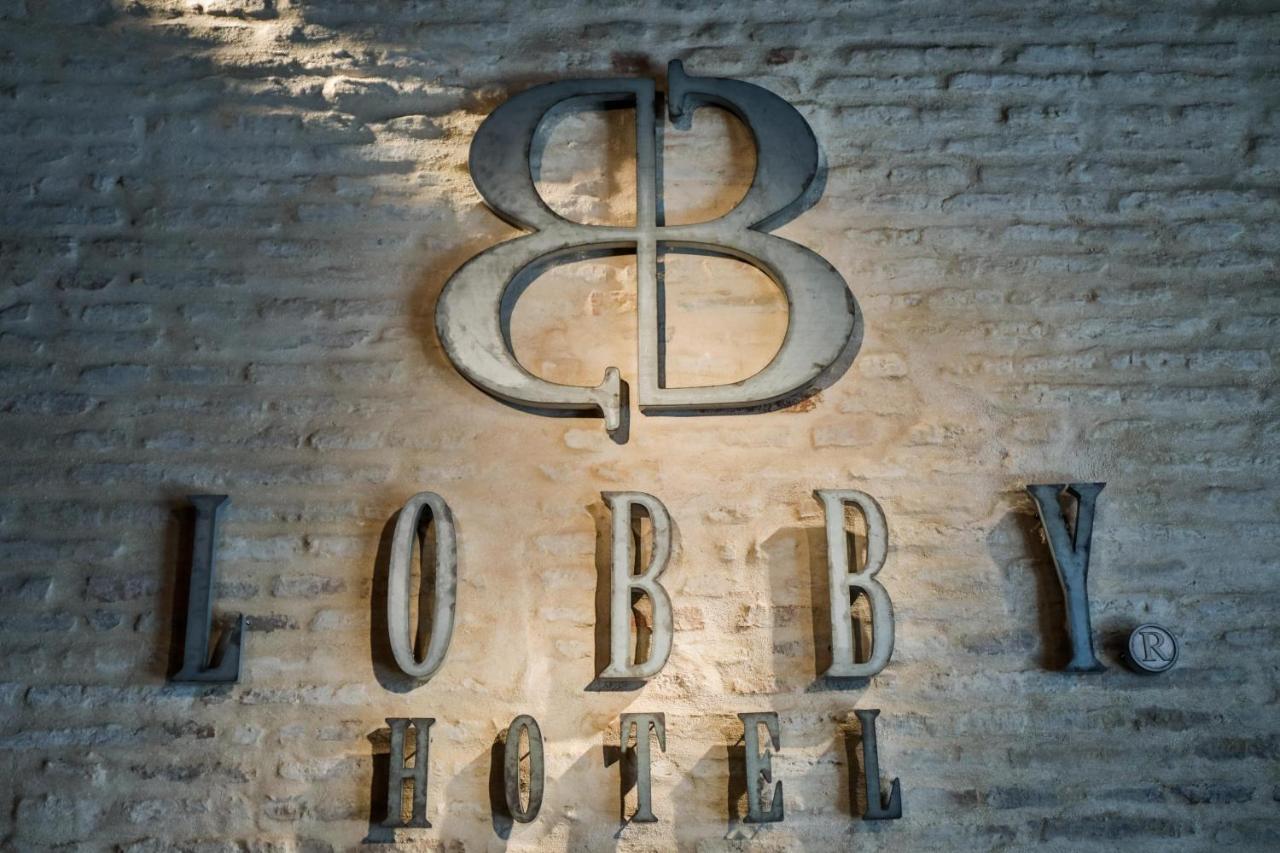 Hotel Lobby Sevilla Exterior foto The logo of the 88th Fighter Group